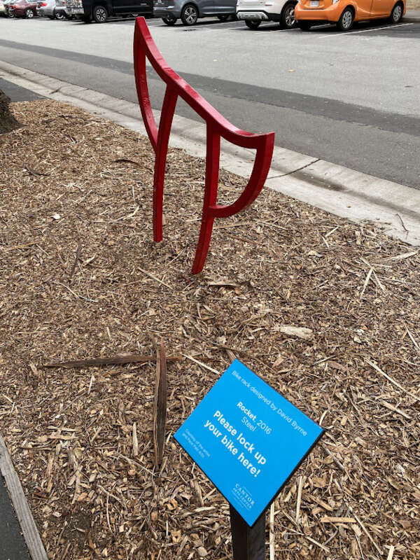 A bike rack titled 'Rocket' designed by David Byrne, located outside the Cantor Arts Center at Stanford University, photographed on December 3, 2023