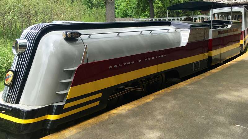 Locomotive of Tauber Family Railroad pulling into the Africa Station at the Detroit Zoo.