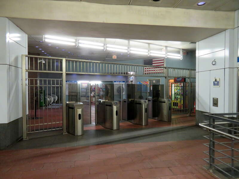 The east faregates at Aquarium station in July 2019