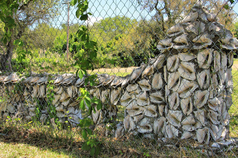 The conch shell fence at the entrance to Eddingston Court in Port Arthur, Texas, United States. The fence is a sculpture by Dionicio Rodriguez.