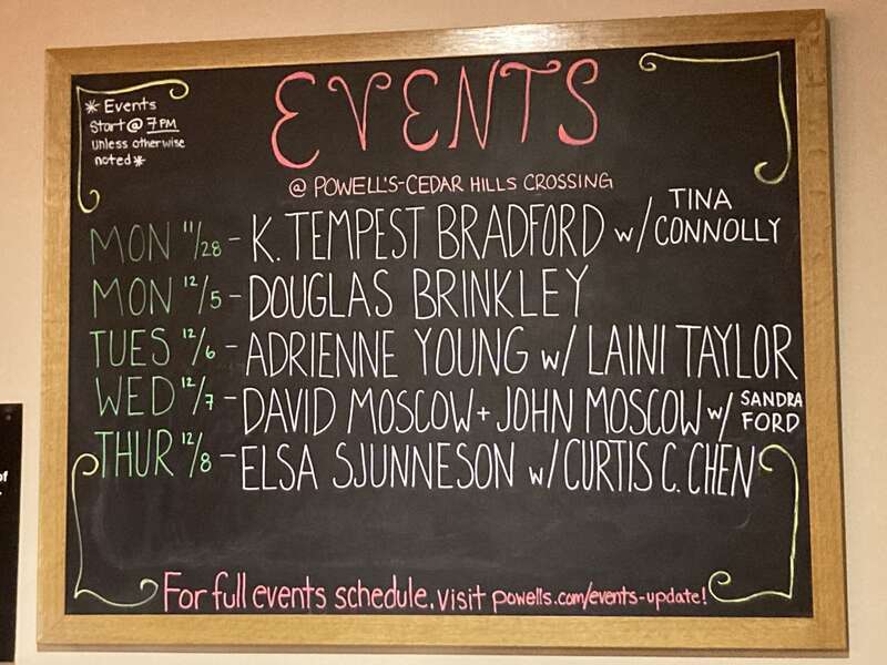 Event chalkboard at Powell's Cedar Hills. It includes K. Tempest Bradford, Douglas Brinkley, Curtis C. Chen, Tina Connolly, Sandra Ford, David Moscow, John Moscow, Elsa Sjunneson, Laini Taylor, and Adrienne Young.