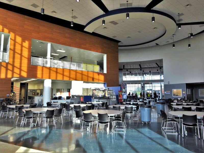 Surrounded by natural light, the &quot;Learning Hub&quot; at the FM9 freshman campus is an open, fluid space that combines activities traditionally associated with a library and a cafeteria. 
Flower Mound High School in Lewisville, Texas, opened its