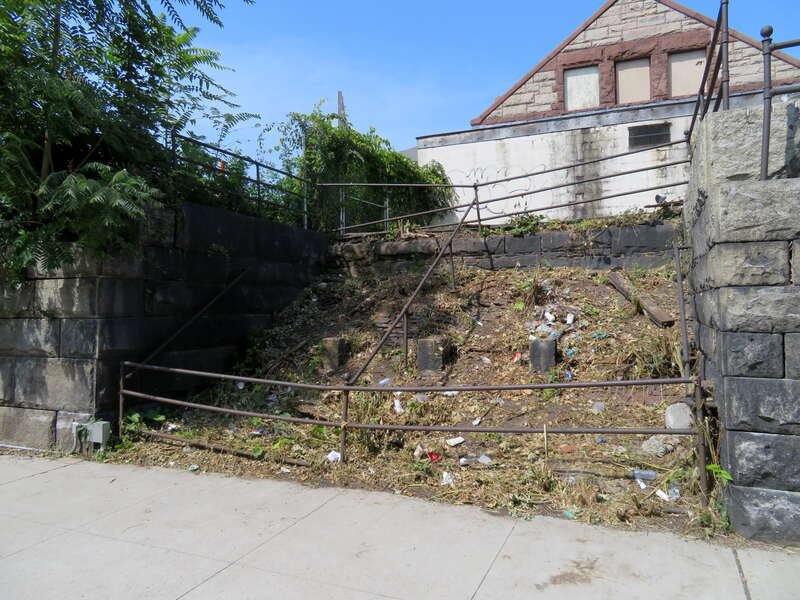 Remains of a staircase outside the former Holyoke station in August 2018