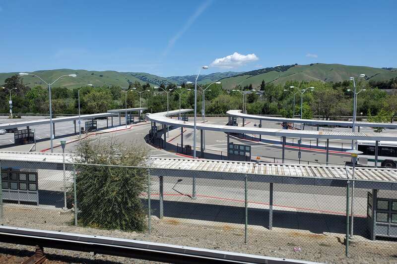 The bus plaza at Fremont station viewed from the BART platform in April 2024