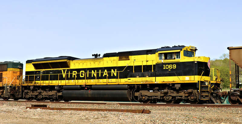 Norfolk Southern 1069(SD70ACe) Virginian Heritage Unit along with Burlington Northern Santa Fe 8942(SD70MAC) are DPU power a Northbound Empty Coal Drag seen here just north of CP Rosedale on the BNSF Fort Scott Sub. The lead units are Burlington