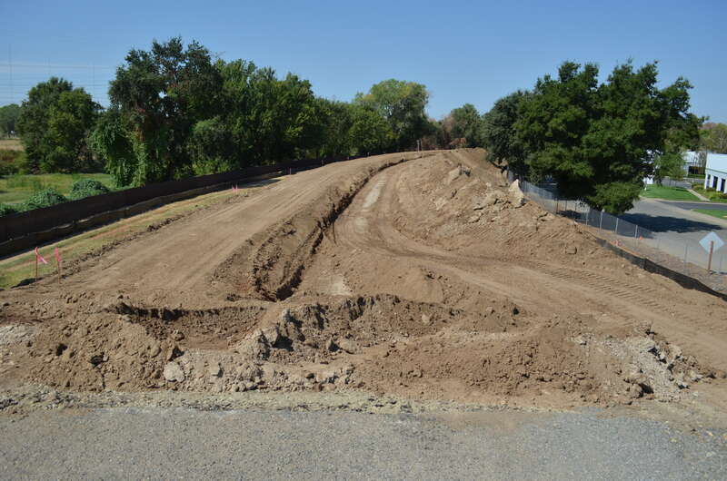 U.S. Army Corps of Engineers Sacramento District levee work is underway Aug. 21, 2013 along the north bank of the American River, just east of its confluence with the Natomas East Main Drainage Canal in north Sacramento, Calif. Complicating the