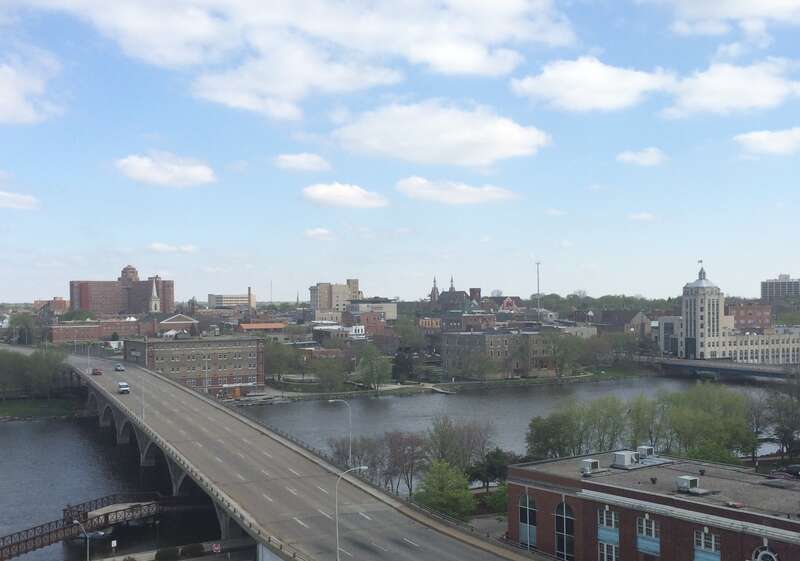 An overview of eastern downtown Rockford, including the Rock River and the Jefferson Street Bridge.