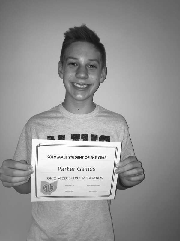 Parker holding his certificate on the day he received the news.