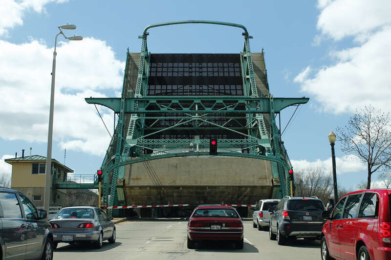 Roadway view of the Cass Street Bridge, in Joliet, Illinois, during an opening of the draw span.  The bridge, which carries westbound US Route 30, is a Scherzer rolling-lift-type bascule bridge.