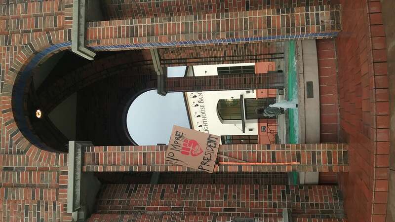 The clock tower and fountain in Santa Cruz, California, with a sign saying &quot;No more president&quot; during protests against the inauguration of Donald Trump on January 20th 2017.