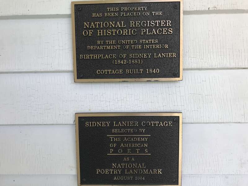 Signs showing what associations honor the Sidney Lanier Cottage.