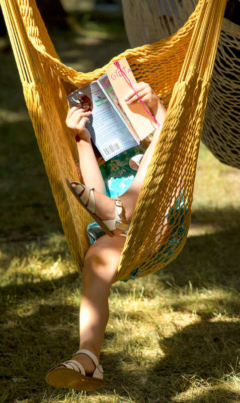 I caught this girl at the Salem Art Fair. She would have been content to sit and read in this hammock chair all day.