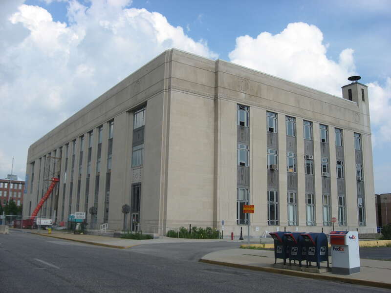 Front and western side of the Terre Haute Post Office and Federal Building, located at the junction of Seventh and Cherry Streets in Terre Haute, Indiana, United States.  Built in 1932, it is listed on the National Register of Historic Places.