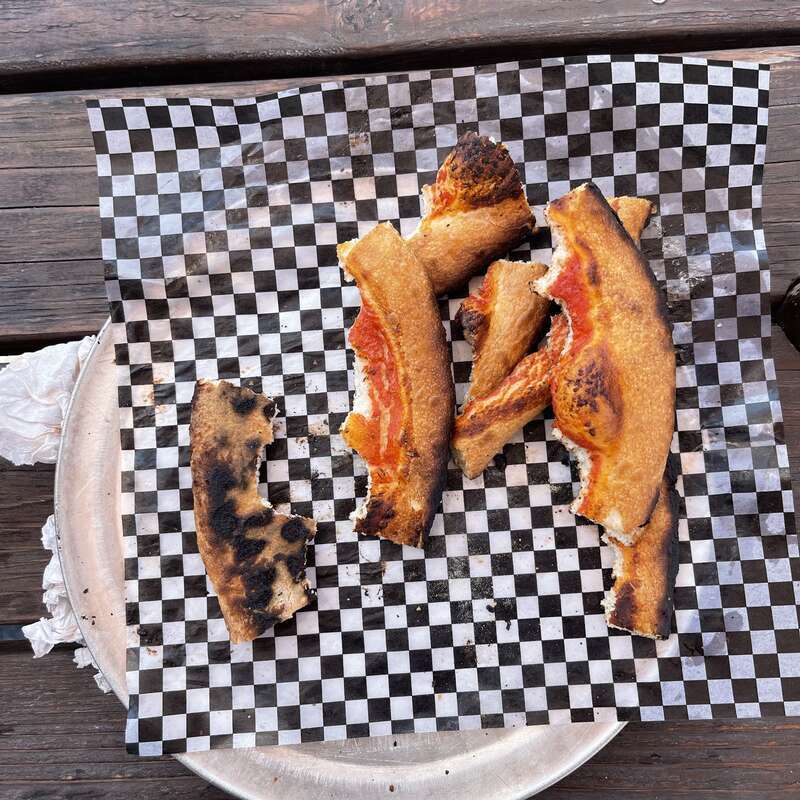 Leftover pizza crust at The Block Petaluma, Petaluma, California.