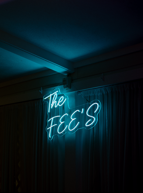 The Fee’s Wedding Neon Sign – A 36-inch (W) x 20-inch (H) ice blue neon sign displayed at Logan &amp;amp; Benny’s wedding in Michigan, USA.