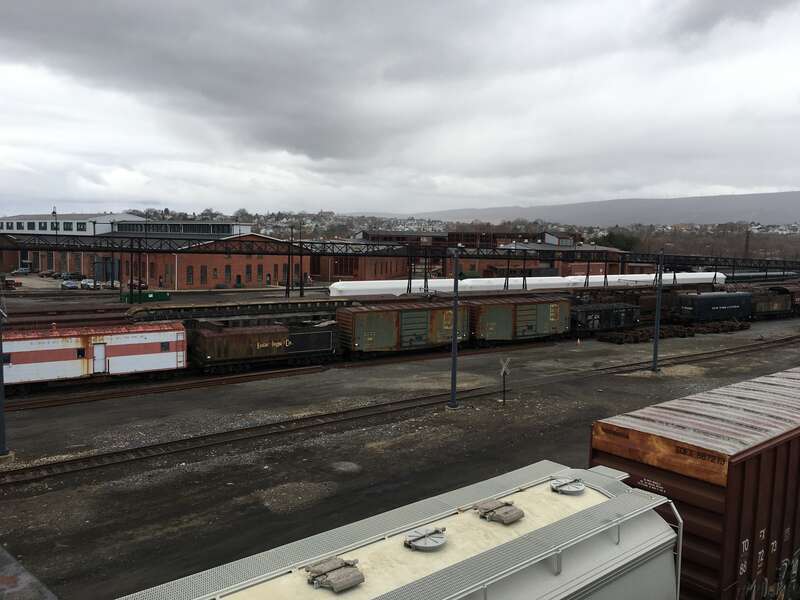Trains on railroads at national historical site in late winter.