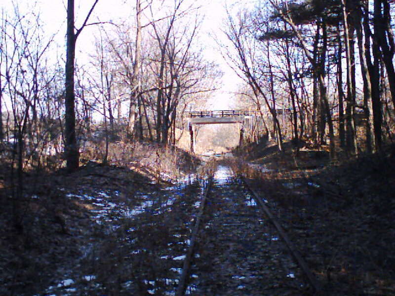 Watertown Branch Railroad (north) at Fresh Pond Reservation, Cambridge, Massachusetts. Shown is the bridge (re-built in 1997) leading into Kingsley Park.