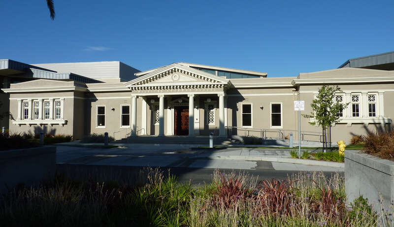 Milpitas Grammar School (built 1915), listed on the National Register of Historic Places, has also served as City Hall, a library and a Senior Center.  In 2006 it was integrated into a new community library building.  Milpitas, California, USA.