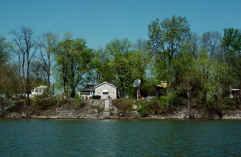 Looking ~WNW from Ohio River toward Indiana bank.
Photo 10 of 25-photo series of Ohio River mile 596 (right descending bank), taken from boat moving upstream (left to right).
.
Houses on South Front Street, Utica, Indiana.
.
Ohio River mile 596