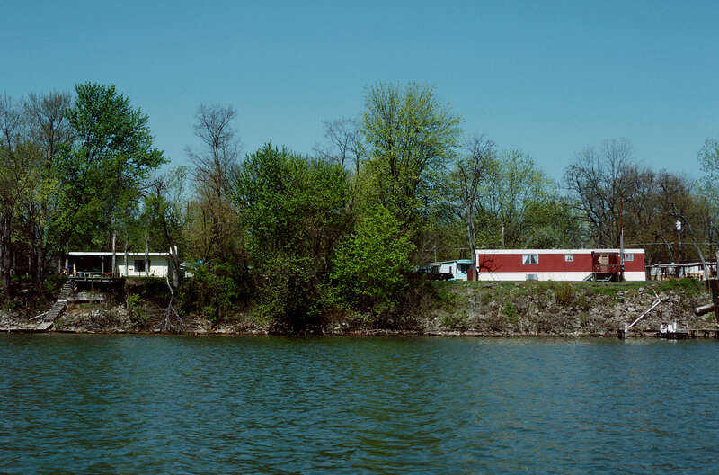 Looking ~WNW from Ohio River toward Indiana bank.
Photo 11 of 25-photo series of Ohio River mile 596 (right descending bank), taken from boat moving upstream (left to right).
.
Houses on South Front Street, Utica, Indiana.
.
Ohio River mile 596