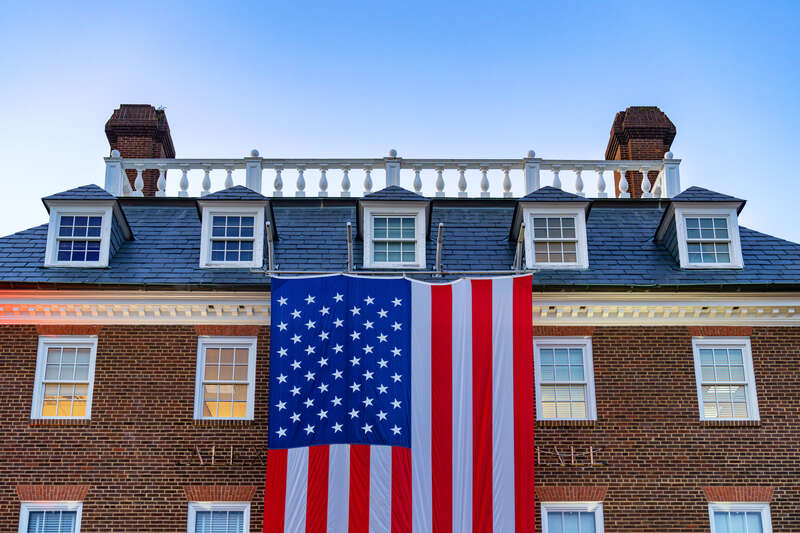 The American flag hangs from City Hall in Alexandria, Virginia.