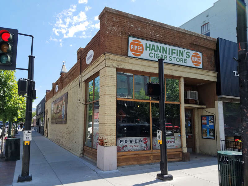 The Beckwith building (1897) was designed by John E. Tourtellotte as storeroom space for H. H. Beckwith, and it was a stop for the Silver City Stage. The building has been home to a cigar store since 1909, and Hannifin's has occupied the store since