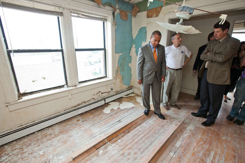 Friday, May 25, 2012 - Governor Deval Patrick observes the damage at the Center City Apartments in Springfield from the June 1, 2011 tornadoes. (Photo: Eric Haynes / Governor's Office)