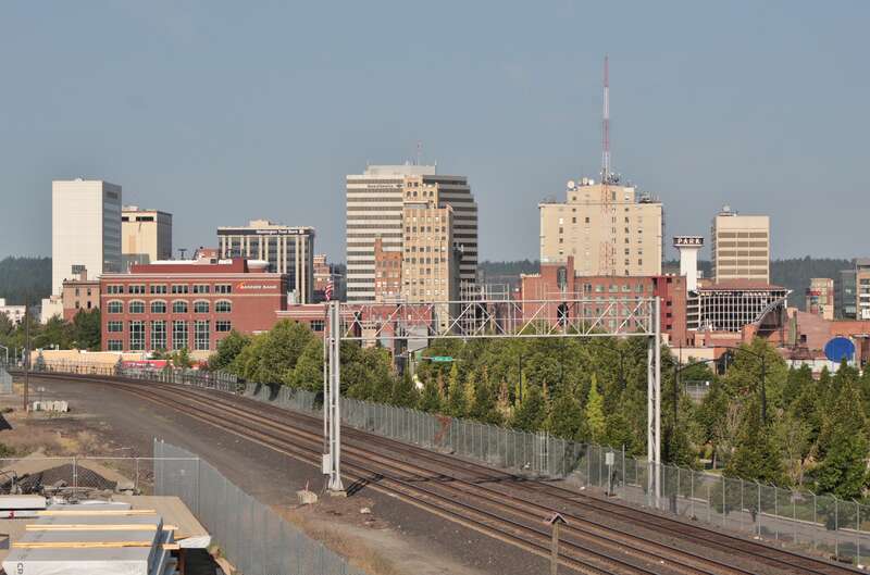 The skyline of Downtown Spokane seen from the University District Gateway Bridge, which crosses over a railroad east of the central business district.