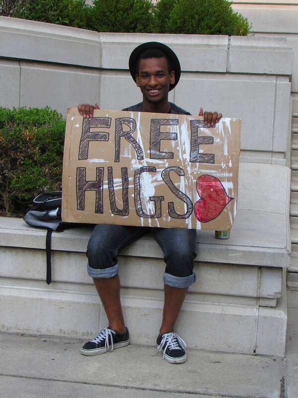 A man holds a "FREE HUGS" sign at Millennium Park in Chicago, Illinois.
More at The Schumin Web:
&amp;lt;a href="http://www.schuminweb.com/2011/08/11/and-fun-was-had-in-chicago-too/" rel="noreferrer