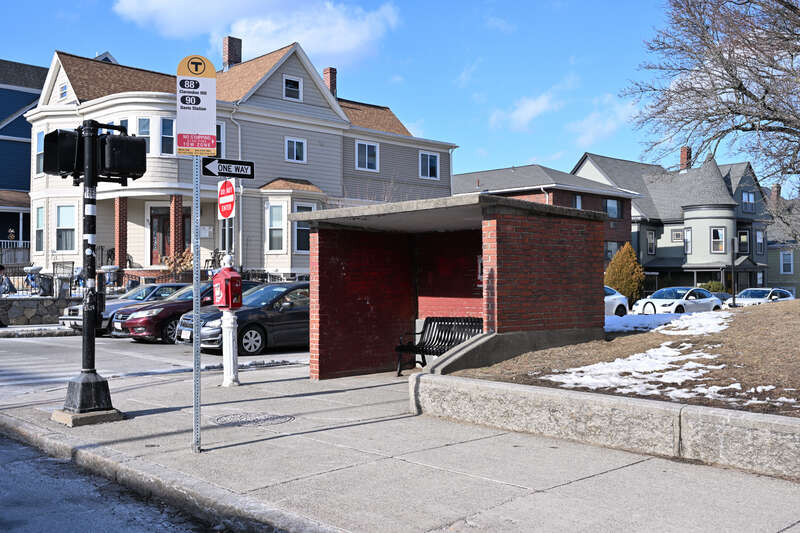 The bus shelter at Highland Ave and School St on Highland Ave in Somerville, in front of city hall