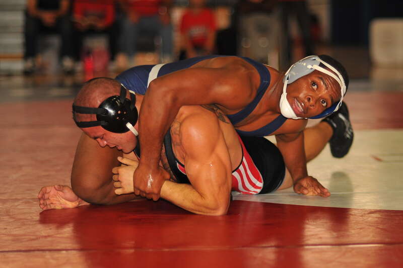 Tyree Cox looks towards his coaches for suggestions on how to move the match forward.  Christopher Bascon seems to be firmly rooted on the mat and is not initiating any action.
Championship Semi Finals
174# Tyree Cox (Cerritos College) MAJ DEC Chris