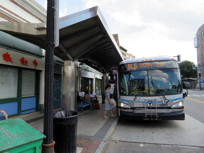 An MBTA route SL5 bus inbound at East Berkeley Street in July 2019