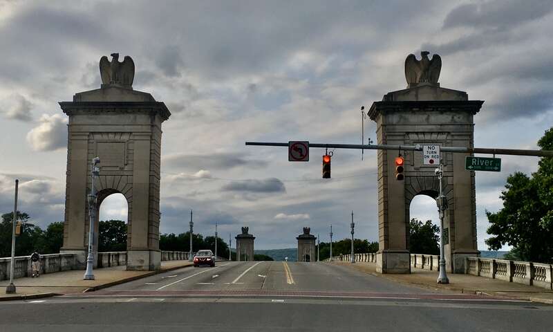 The Market Street Bridge over the Susquehanna River as seen from its east end, at the corner of River Street in downtown Wilkes-Barre, Pennsylvania in September 2020. Designed by the firm of Carrère and Hastings, the bridge was completed in 1929 and