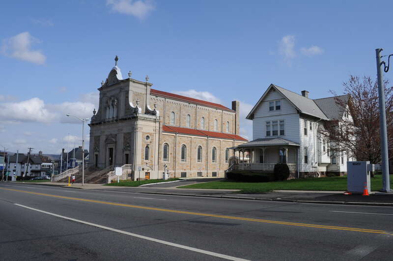 147 Washington Street, Saint Sebastian Church, Middletown, Connecticut, USA. The building is a contributing property of the Washington Street Historic District, which is on the National Register of Historic Places. At right is the rectory at 155