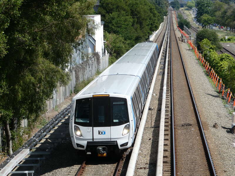A northbound Green Line train viewed from the Sycamore Avenue footbridge in Hayward in May 2024
