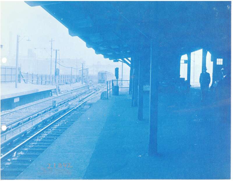 View northeast from the outbound platform at Everett station in April 1927, showing a train on the tail tracks