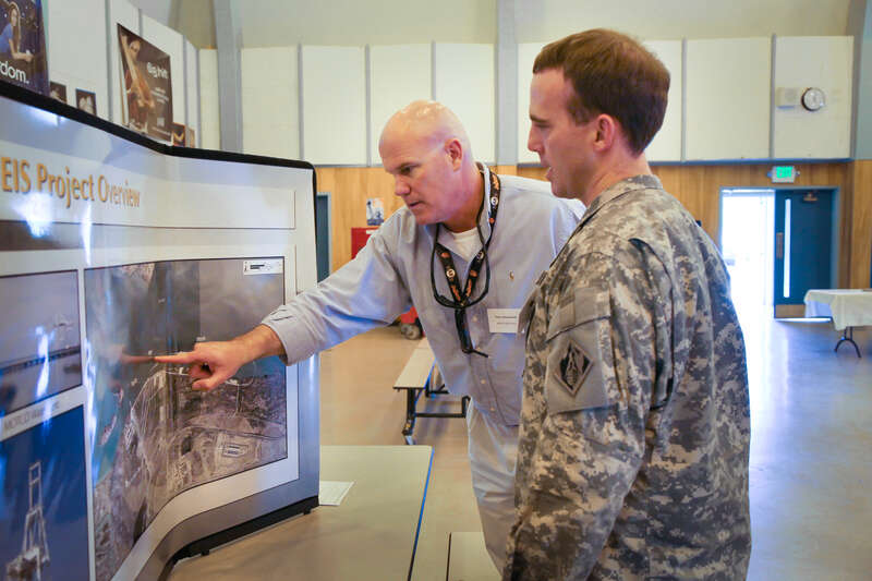 Pete Broderick (left), project manager with the U.S. Army Corps of Engineers Sacramento District, points out Pier 2 during a Military Ocean Terminal Concord public meeting April 25, 2013 in Concord, Calif. to Lt. Col. Braden LeMaster the district's