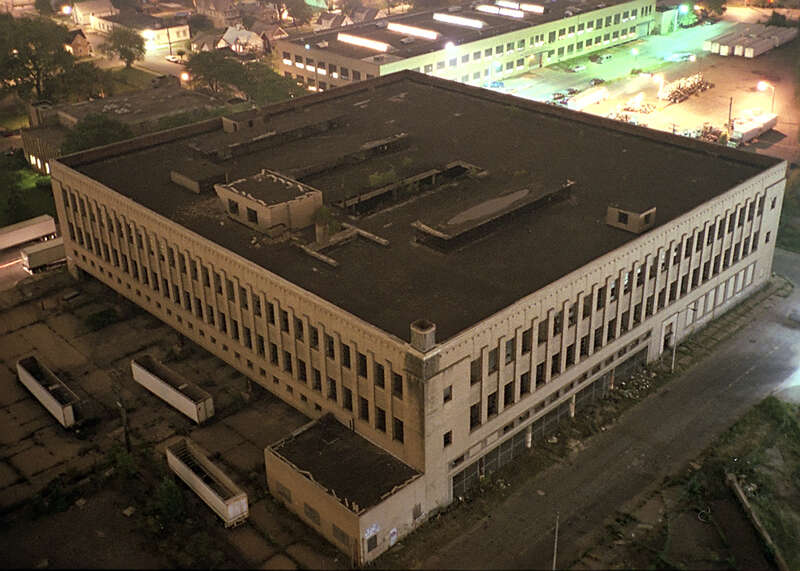 The Roosevelt warehouse Detroit school book depository building in August of 2000, after being damaged by fire and abandoned. Ailanthus altissima is visible growing on the third floor beneath a hole in the roof.