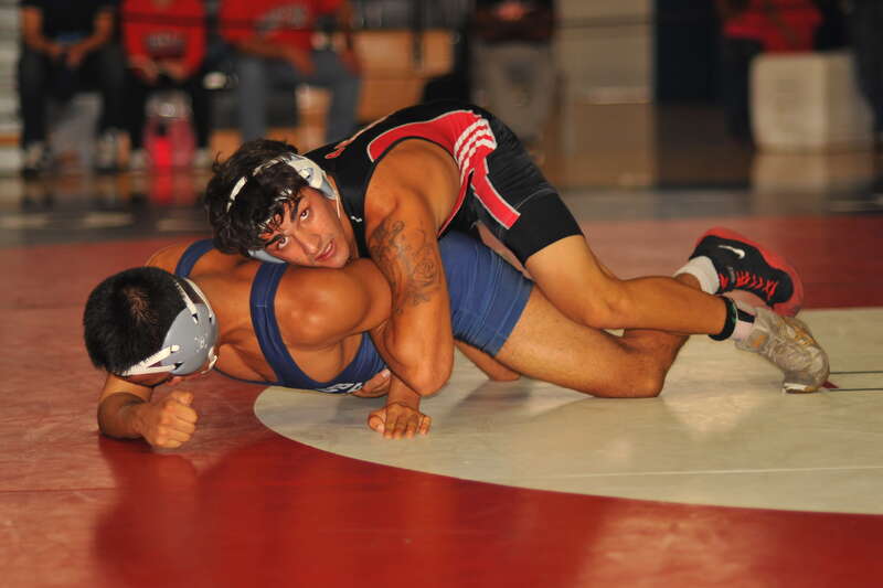 Shervin Iraniha grabs Yuuki Murai's arm to try to get a chicken wing.
Championship Semi Finals
157# Shervin Iraniha (Palomar College) FALL Yuuki Murai (Cerritos College) FALL

BIV_8419_cr
