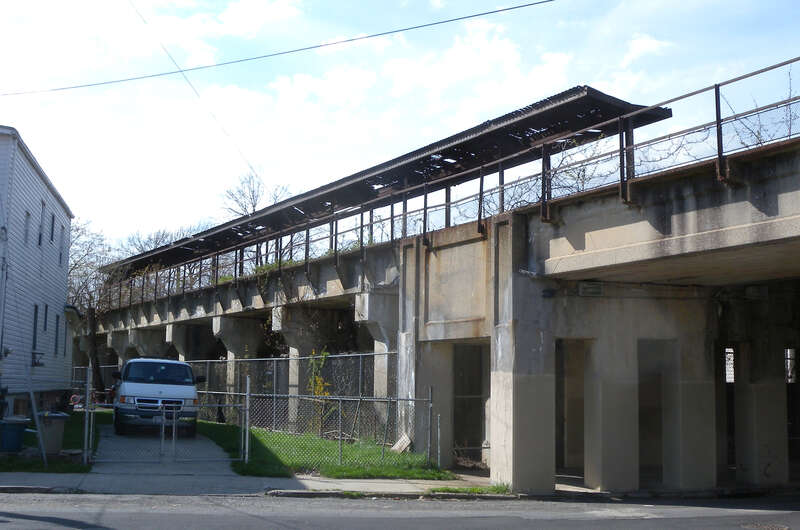Looking northwest across Sharpe Avenue at Tower Hill station on a sunny early afternoon.
