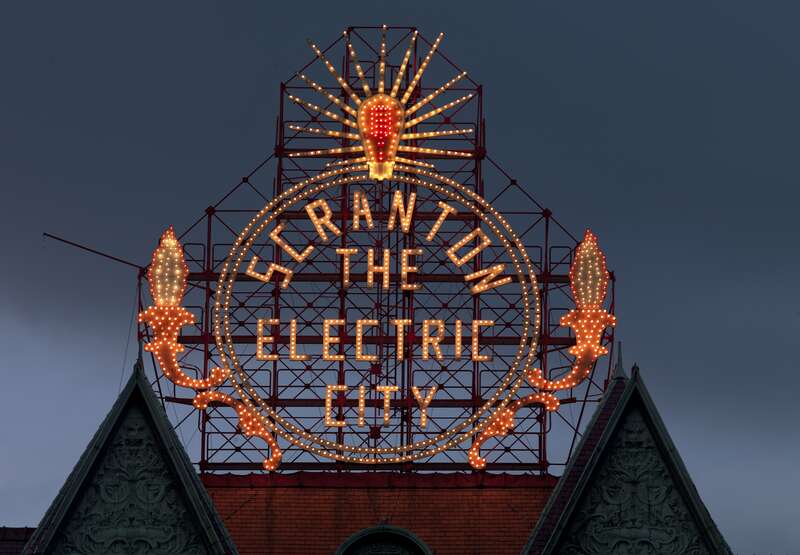 The sign "Electric city" in Scranton, Pennsylvania, photographed by Carol M. Highsmith, who has donated her collection to the Library of Congress and made it public domain.  See https://www.loc.gov/pictures/item/2010646302/