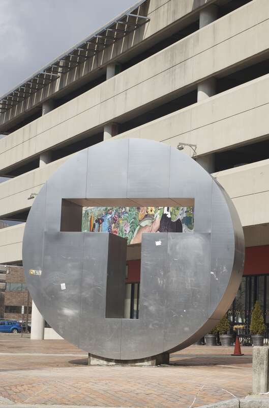 The metal T sculpture on the plaza to the south of the Alewife MBTA station in Cambridge, Massachusetts.