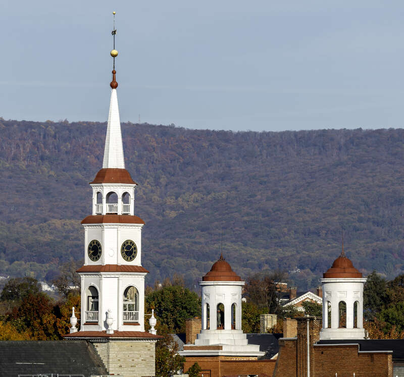 The spire of Trinity Chapel and the cupolas of Evangelical Reformed Church, with Catoctin Mountain behind, Frederick, Maryland, USA