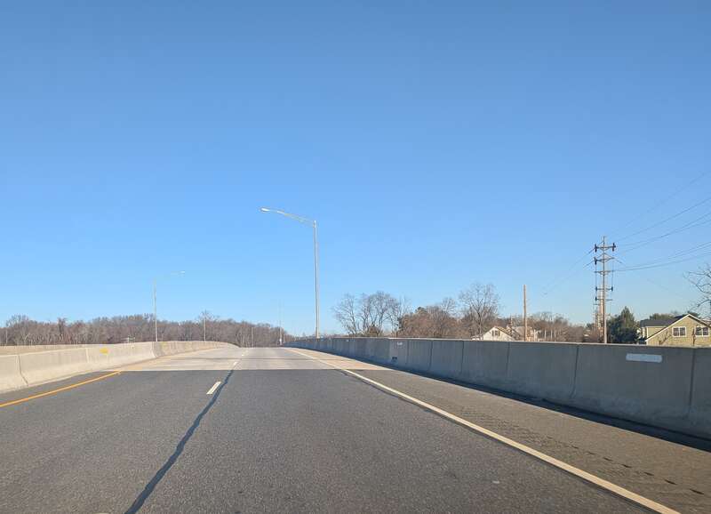Photo of northbound U.S. Route 130 in Logan Township, New Jersey at the bridge crossing Raccoon Creek. Photo taken looking east-northeast towards the community of Bridgeport.