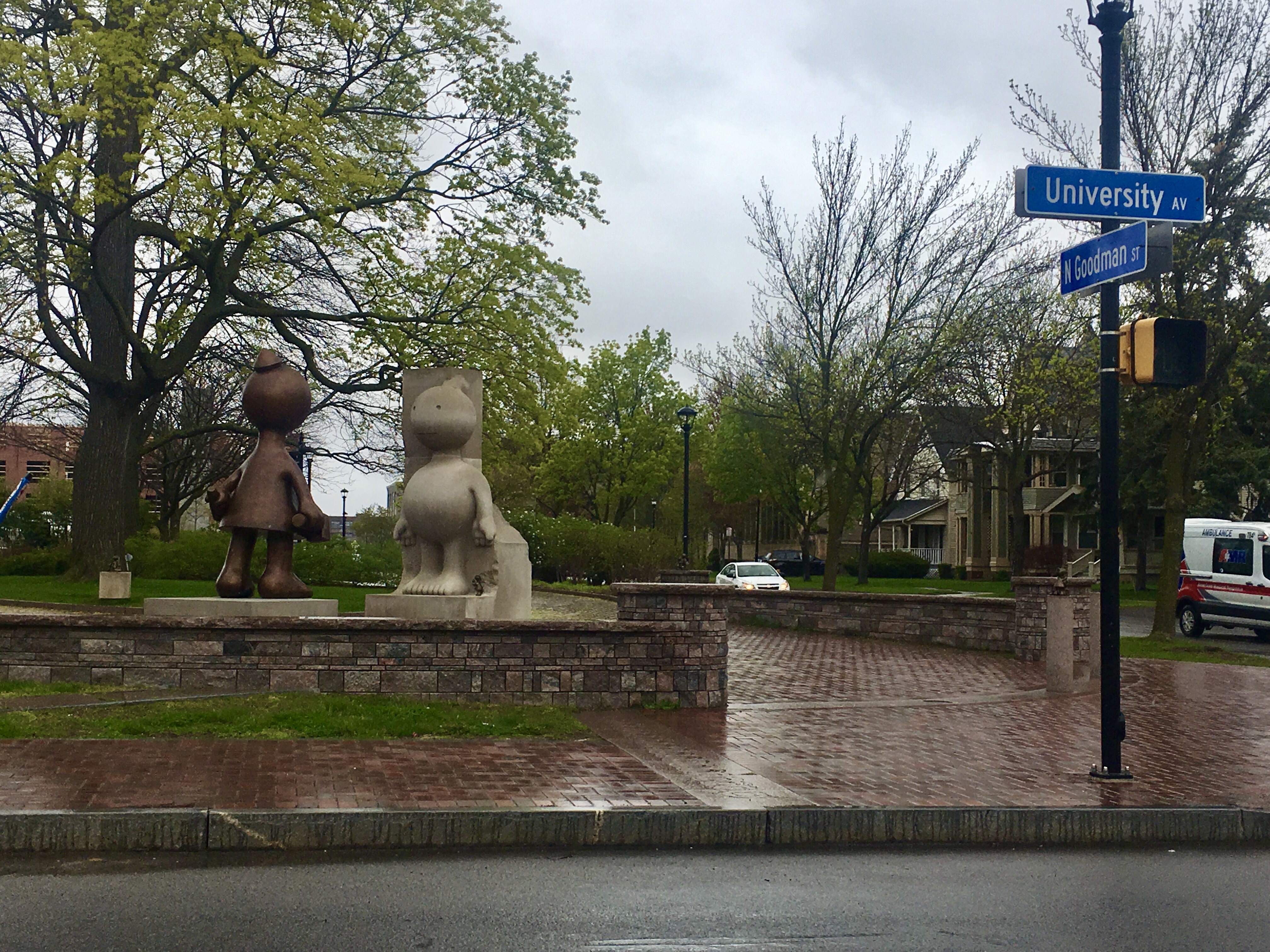 Creation Myth by Tom Otterness, Brooklyn, New York, at the Centennial Sculpture Park on the grounds of the University of Rochester's Memorial Art Gallery, as seen from the corner of University Avenue and North Goodman Street, Rochester, NY, 12th May