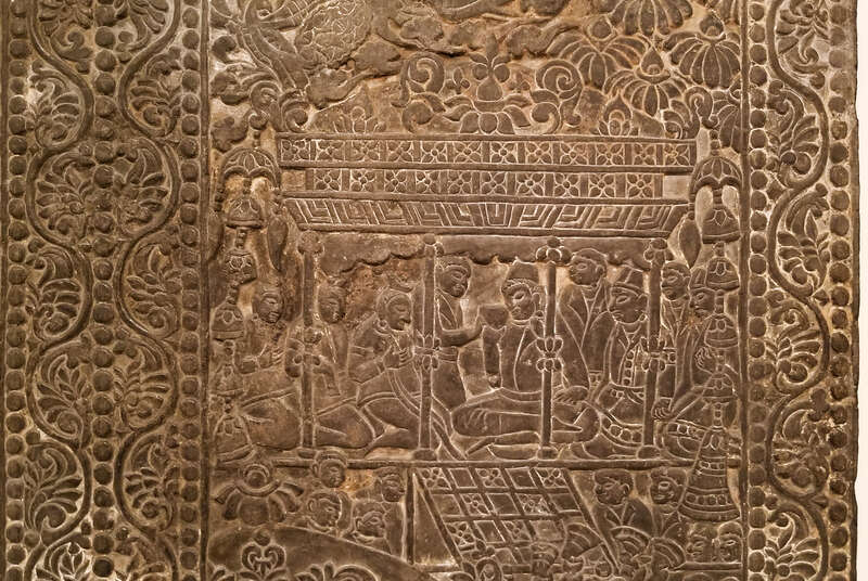 Back panel of a funerary bed showing the deceased drinking from a bull headed rhyton and entertained by fancers and musicians under a grape arbor. Sogdian and Zorastrian imagery. China, Northern Qi, 550 AD - 577 AD, From the Museum of Fine Arts,