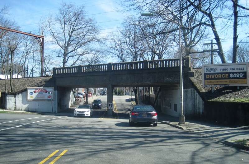 Photo of northbound County Route 509 (Grove Street) approaching Livingston Avenue and the overpass carrying the Montclair-Boonton Line over the road in East Orange, New Jersey. Photo taken looking northeast.