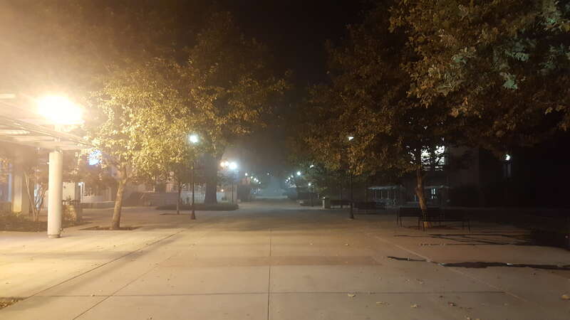Smoke from the Camp Fire hangs over the CSU Chico campus during a night of &quot;Hazardous&quot; air quality