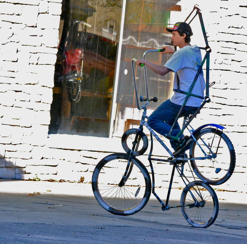 I caught this guy taking his contraption out for a spin one sunny afternoon in Gainesville Florida outside of "Spin Cycle," bike shop. 

The exposure on the back wall is really hot but other than than that not bad. Looks like it's a combo of two