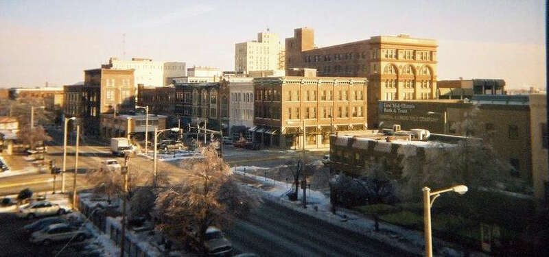A view of downtown Decatur, IL (primarily Merchant Street), from the southwest.  Merchant Street is the short street in the center.  From the top left to bottom center is North/South Main Street (U.S. Route 51); the cross street is East/West Main